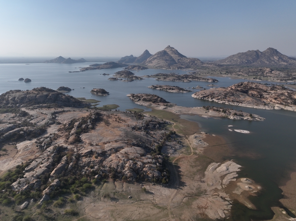 Experience the Best Jawai Leopard Safari in Rajasthan Aerial view of Jawai hills and dam during sunrise safari