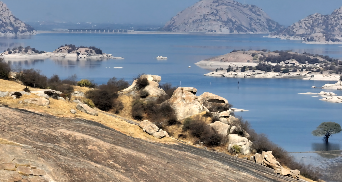 Jawai Bandh dam landscape with water reservoir and granite hills in Rajasthan