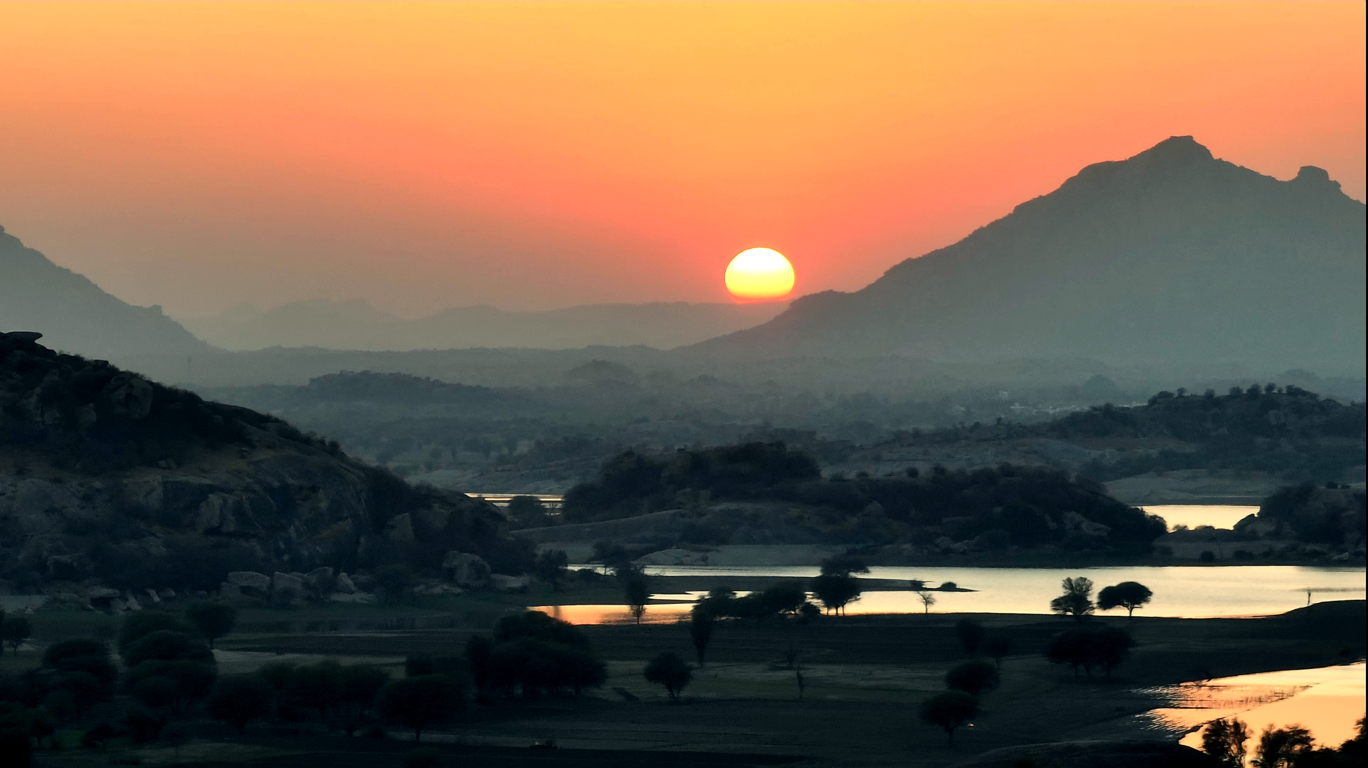 Tourist viewpoint of Jawai Bandh with tranquil water and surrounding landscapes in Jawai.
